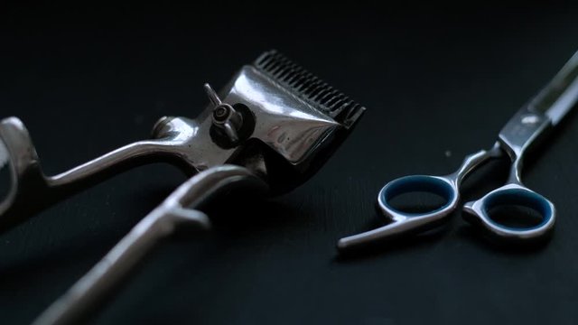 vintage barber tools dangerous razor hairdressing scissors old manual clipper comb shaving brush. on black background