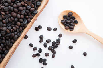 brown and black roasted arabica coffee baens. mashed roasted coffee beans is ingredients of espresso, cappuccino, latte, mocha, americano. coffee is favorite beverage at morning and afternoon break