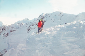 Fototapeta na wymiar two people stand on a mountain ski resort