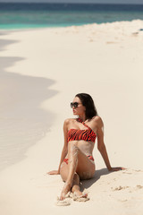 Happy beautiful woman on the beach. Maldives.