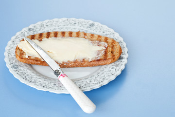 plate of butter over breakfast table