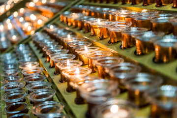 Rows of candles inside of the Milan Cathedral (Duomo di Milano), the cathedral church of Milan, Lombardy, Italy. Dedicated to the Nativity of St Mary.