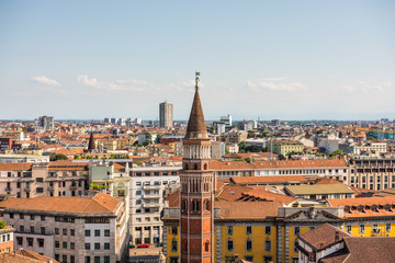   Aerial view of the old downtown of the Milan City with beautiful rooftops, view from the top of cathedral church of Milan, Lombardy, Italy.