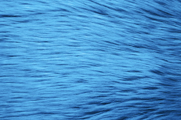 Faux fur as background, top view. Color of the year 2020 (Classic blue)