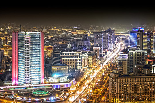 russia moscow city russia architecture cityscape downtown landmark at night against dark sky background. Aerial top side view of town skyline with moscow government skyscraper and new arbat street