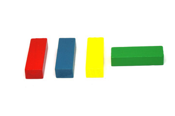 Wooden Kids Toys or jigsaw wooden for Develop children's skills arrange isolated on white background - red yellow green blue color 