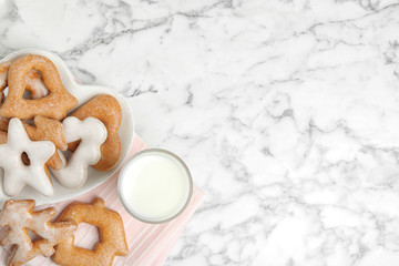 Sweet delicious cookies and glass of milk on marble table, flat lay. Space for text