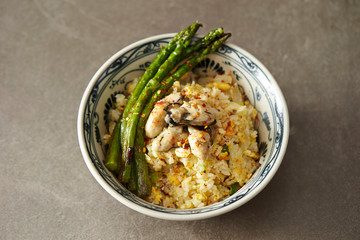 Fried rice with oyster and asparagus 