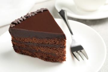 Piece of tasty chocolate cake served on plate