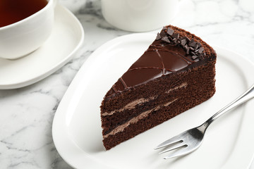 Piece of tasty chocolate cake served on plate