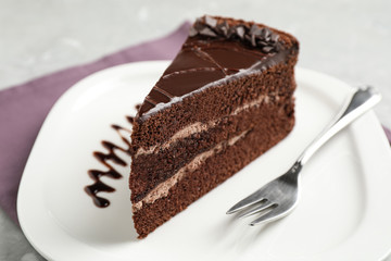 Piece of tasty chocolate cake served on plate
