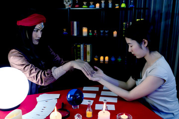 Fortune teller, astrology, prediction, forecast the future to female customers In beliefs, life,...