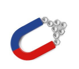 Magnet attracting metal nuts on white background, top view