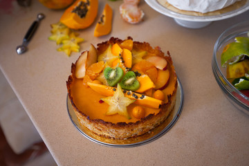 Cake with fresh fruits kiwi dragon fruit papaya mandarin carambola