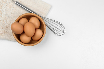 Flat lay composition with raw eggs on white table, space for text. Baking pie
