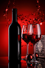 Red Wine Bottle and Glasses with Festive Holiday Feel