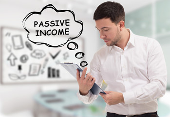 Business, technology, internet and network concept. The young businessman comes to mind the keyword: Passive income