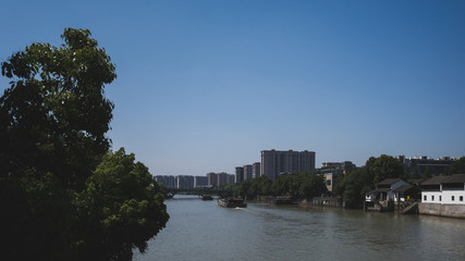 Naklejka premium Cargo ship in Grand Canal in Hangzhou, China