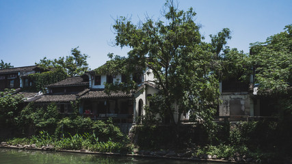 Fototapeta na wymiar Buildings by river in Hangzhou, China