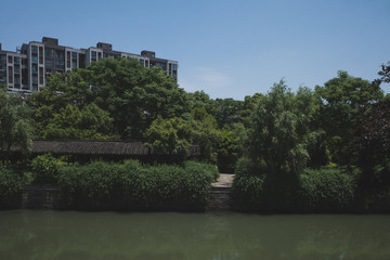 Fototapeta na wymiar Buildings by river in Hangzhou, China