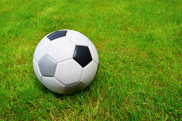 Fototapeta na wymiar Soccer ball on the field close-up. Lifestyle.