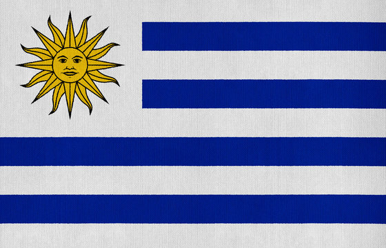 National flag of Uruguay on a cotton texture background