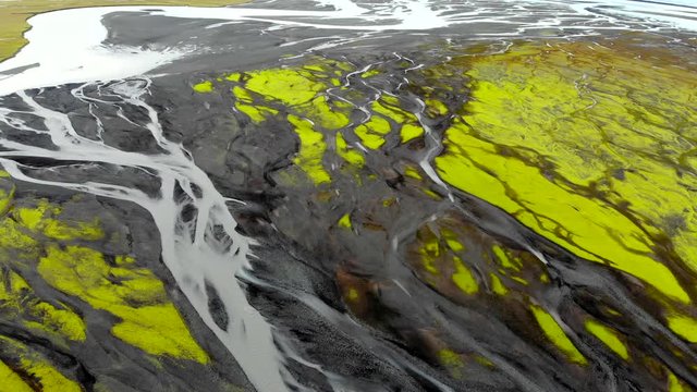 Aerial view of glacier river delta in Iceland, slider shot