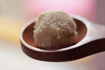  Close-up of coconut rava ladoos in a bowl