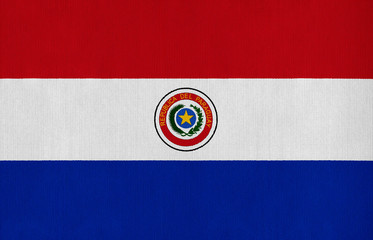 National flag of Paraguay on a cotton texture background