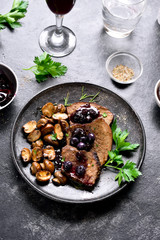 Slow cooked beef with mushrooms and blueberry sauce