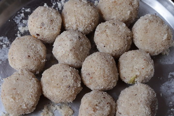 Close-up of coconut rava ladoos in a plate