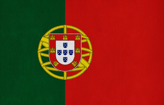 National flag of Portugal on a cotton texture background