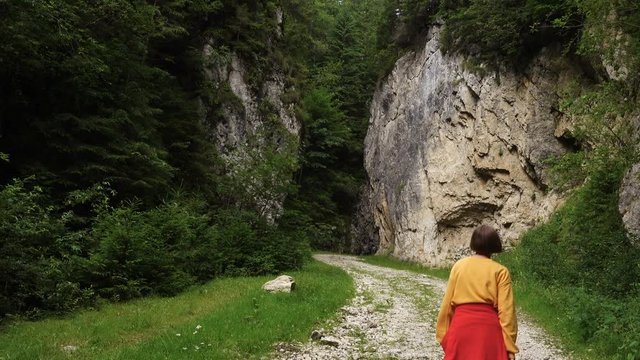 active girl hiking by the Prapastiile Zarnestiului canyon, Piatra Craiului National Park, Romania