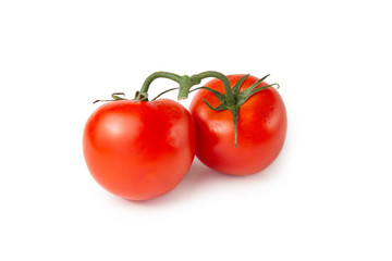 Several tomatoes on a white isolated background. Fresh vegetables.