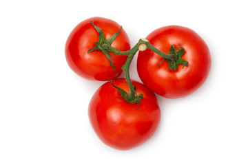Several tomatoes on a white isolated background. Fresh vegetables. View from above.