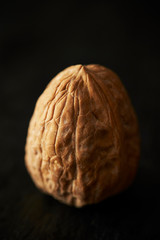 Walnut with shell on black background 