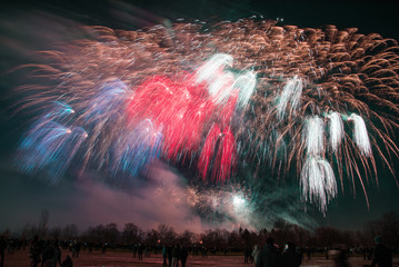 Happy New Year Fireworks in Prague, Czech Republic. National flag sparkling tricolor - blue red white. 100th anniversary of Czechoslovakia (independent state of Czechs and Slovaks) foundation in 1918