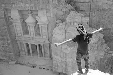 Al Khazneh in the ancient city of Petra, Jordan during the day. It is known as The Treasury. Petra has led to its designation as a UNESCO World Heritage Site. Seven wonder of world