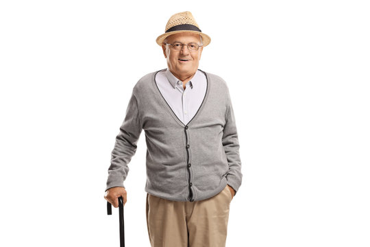 Elderly man standing with a cane