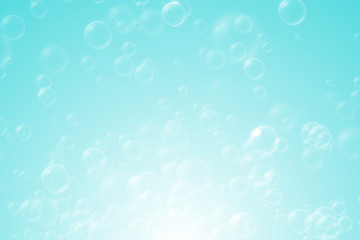 Soap bubbles on blue natural background for kid and spring