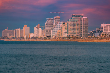 Tel Aviv Skyline, Israel. Cityscape image of Tel Aviv beach with some of its famous hotels during sunset.