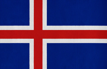 National flag of Iceland on a cotton texture background