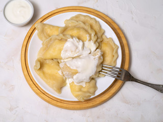 Dumplings with cottage cheese and sour cream.