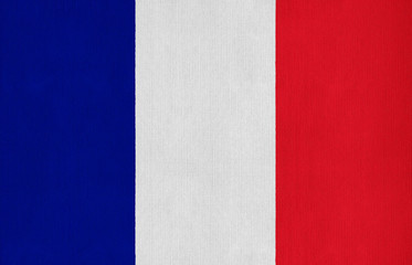 National flag of France on a cotton texture background