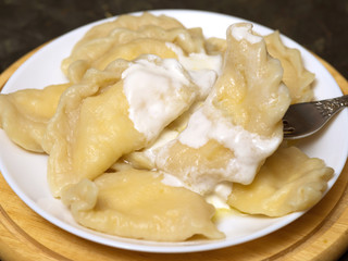 Dumplings with cottage cheese and sour cream.