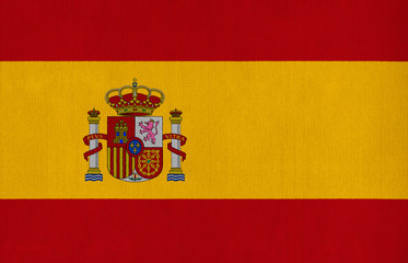 Fototapeta premium National flag of Spain on a cotton texture background