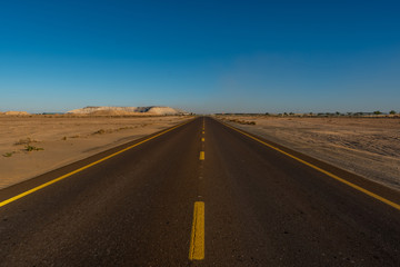Fototapeta na wymiar Road in the desert shot at day time