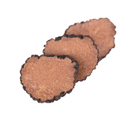Black truffles isolated on a white background. Fresh sliced truffle. Delicacy exclusive truffle mushroom. Piquant and fragrant French delicacy. Clipping path.