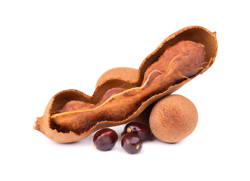 Sweet tamarind isolated on white background. Fresh tamarind fruit and seeds.