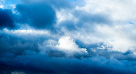 Naklejka na ściany i meble Dark blue clouds short time before the thunderstorm begin